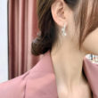 cross curved earrings 1